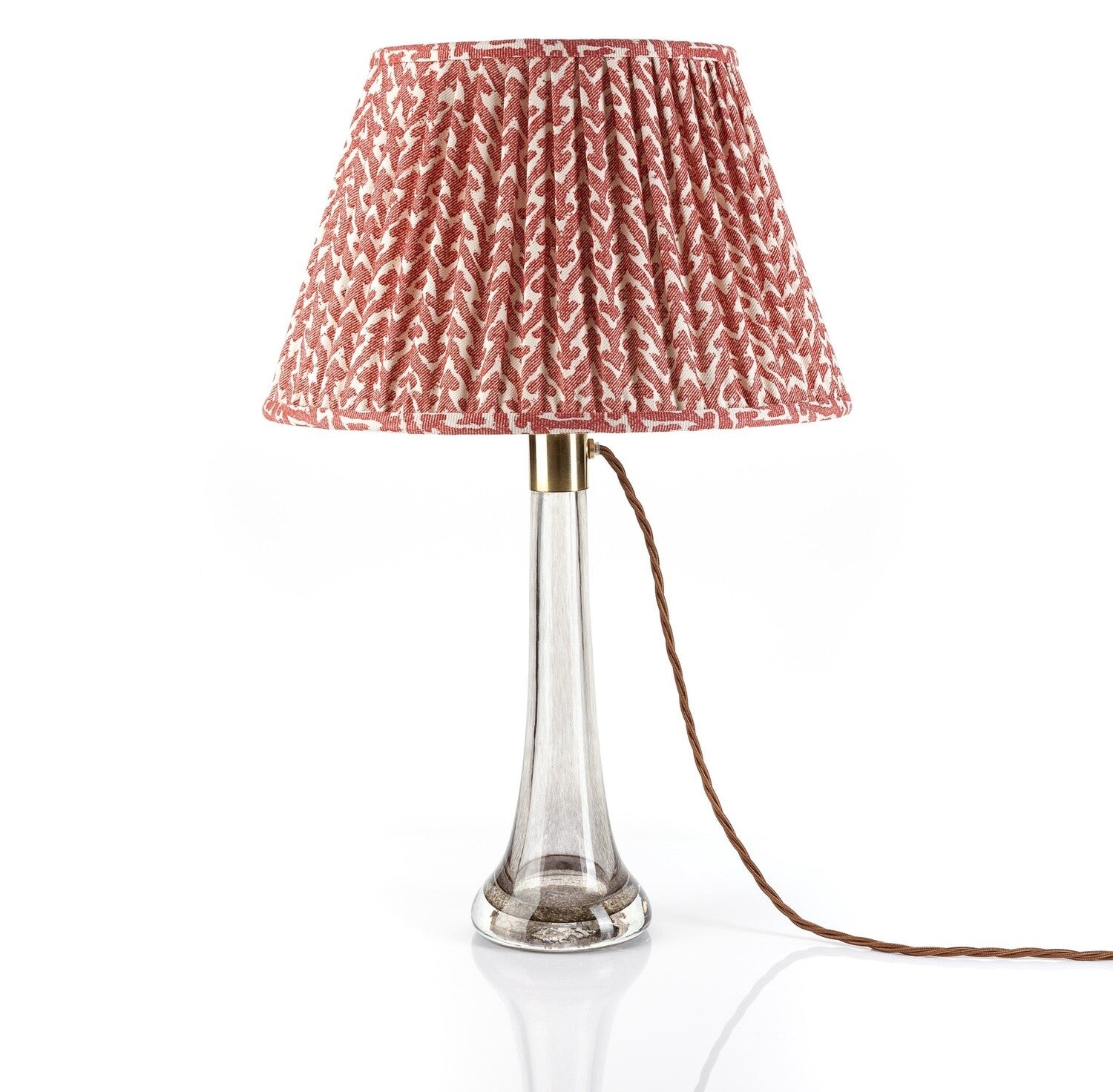 Fermoie Red Rabanna lampshade styled on a glass table lamp in Nashville, Tennessee