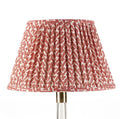 Fermoie Red Rabanna empire lampshade styled on a glass table lamp in Nashville, Tennessee