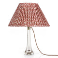 Fermoie Red Rabanna empire lampshade styled on a glass table lamp in Nashville, Tennessee