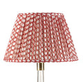 Fermoie Red Wicker empire lampshade styled on a glass table lamp in Nashville, Tennessee