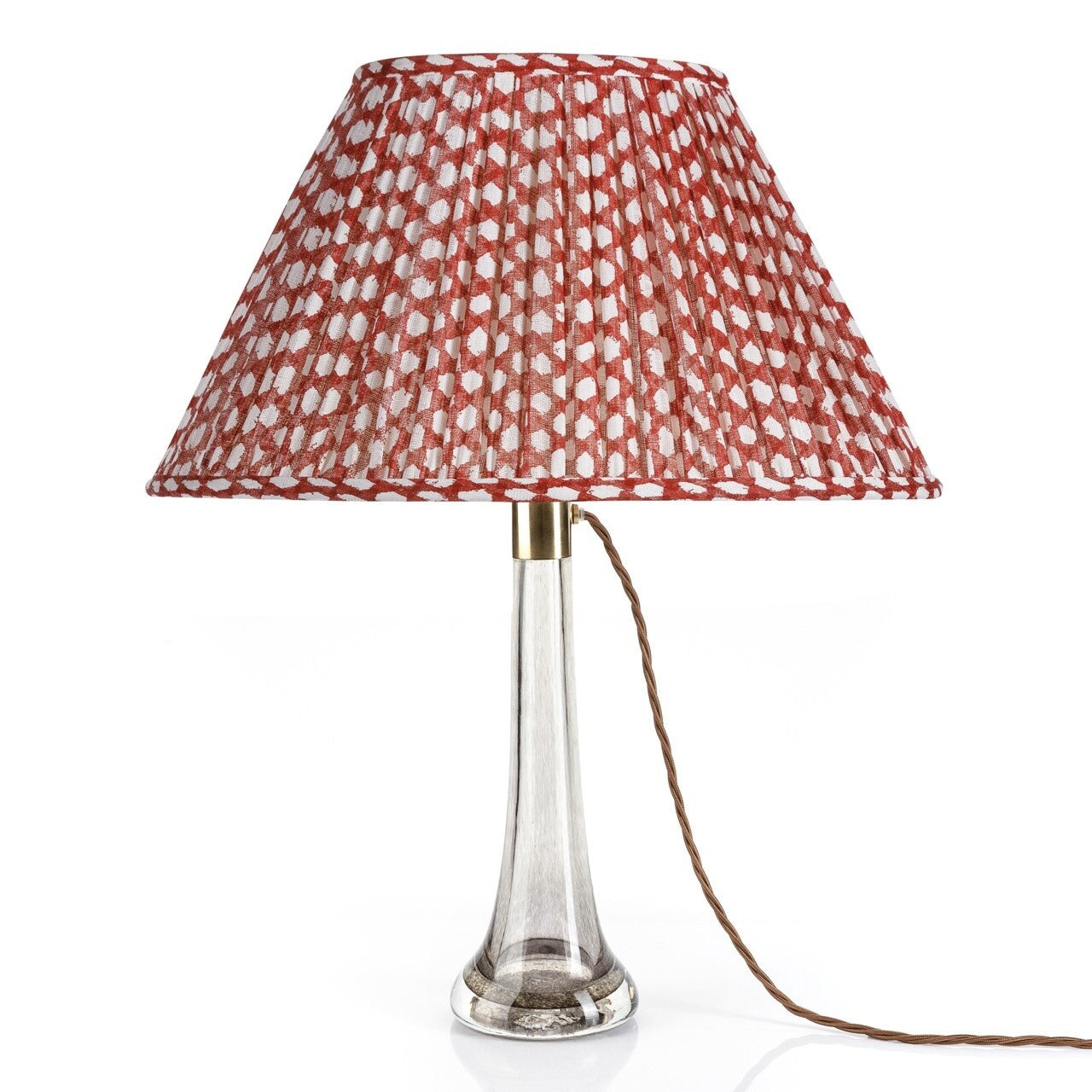 Fermoie Red Wicker Oval lampshade styled on a glass table lamp in Nashville, Tennessee