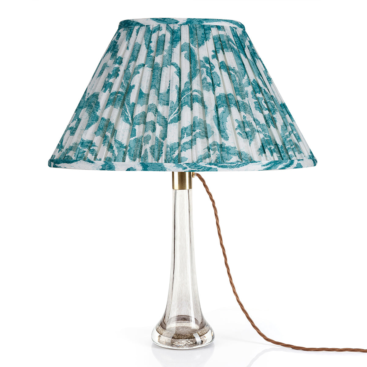 Fermoie Teal Marlborough oval lampshade styled on a glass table lamp in Nashville, Tennessee