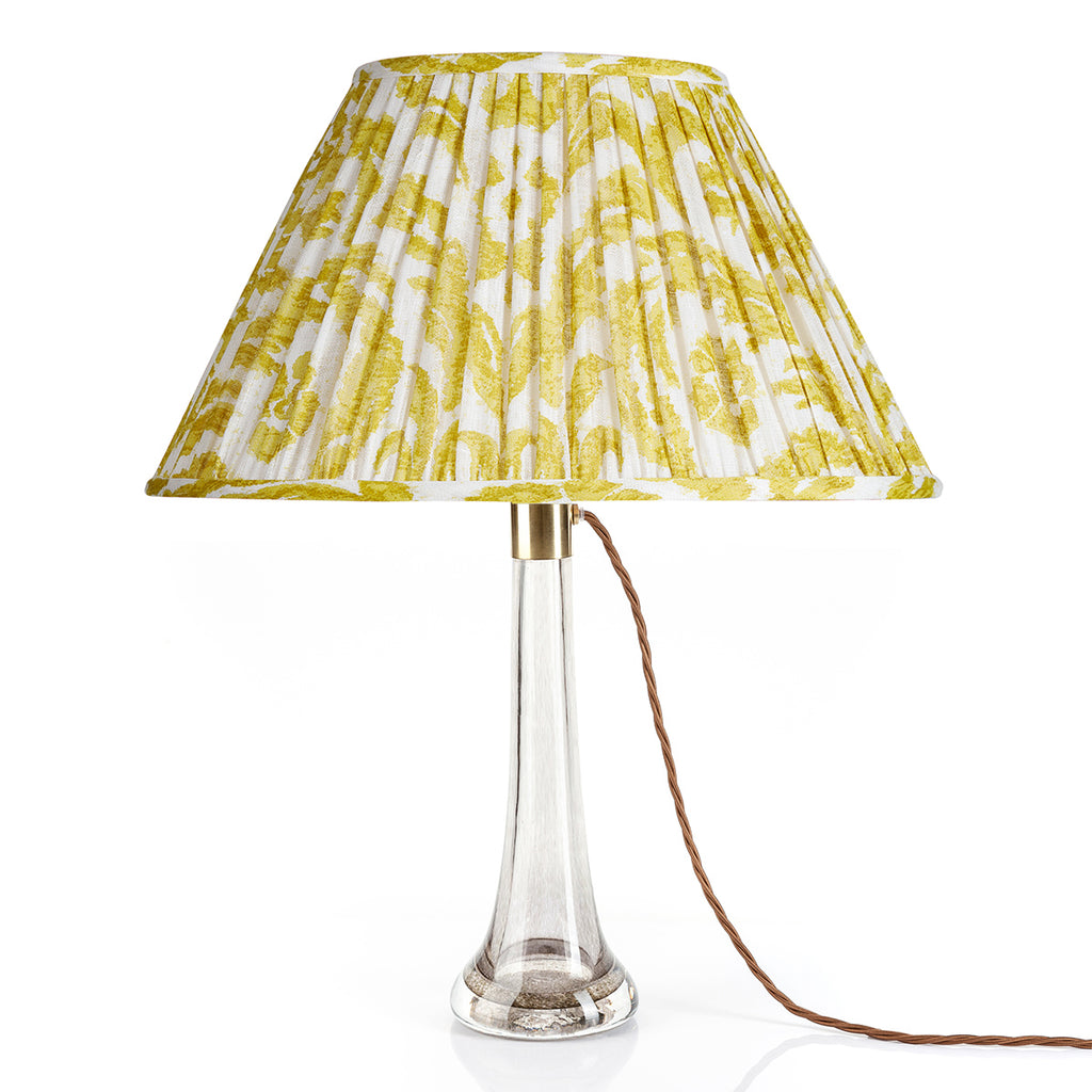 Fermoie Yellow Marlborough oval lampshade styled on a glass table lamp in Nashville, Tennessee