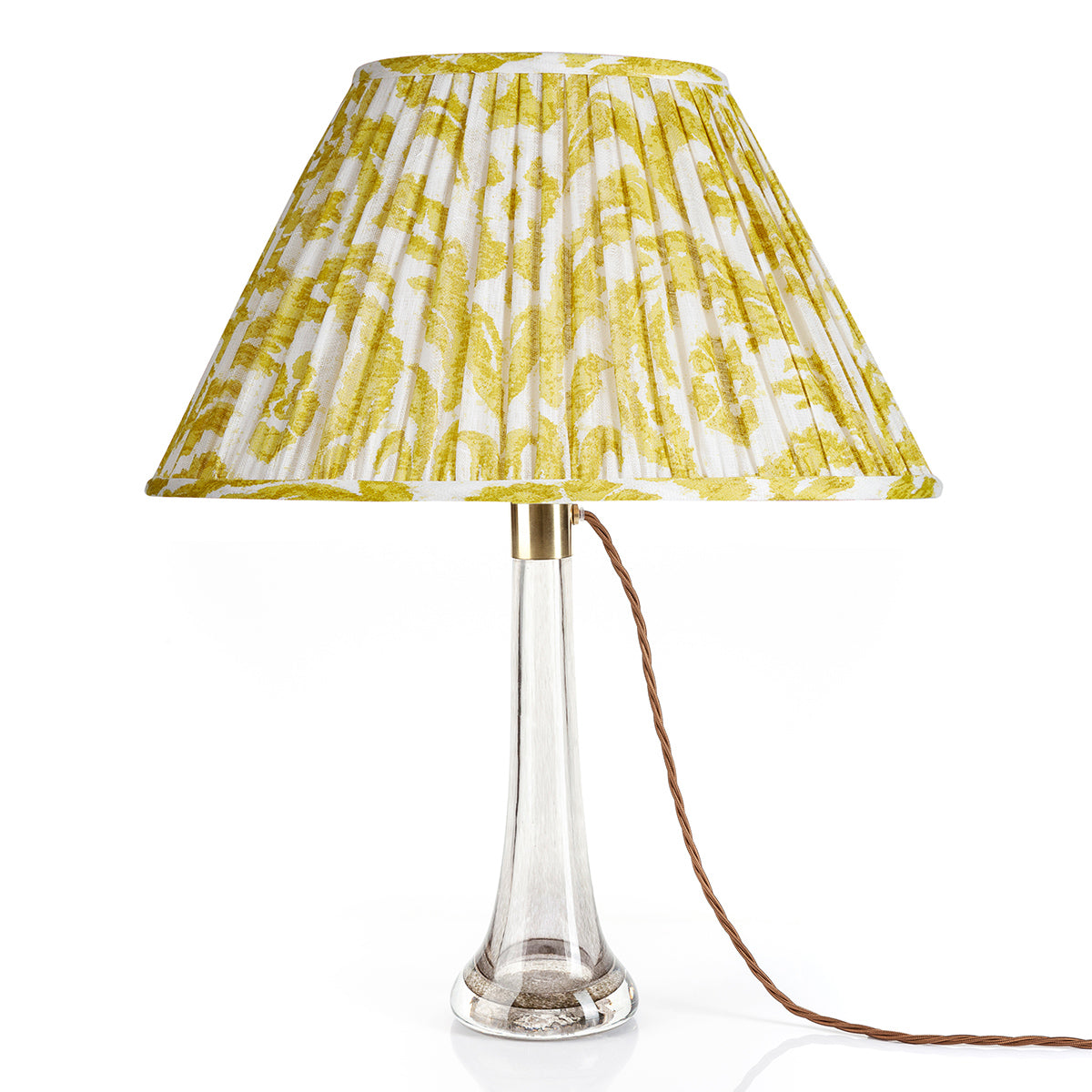 Fermoie Yellow Marlborough oval lampshade styled on a glass table lamp in Nashville, Tennessee