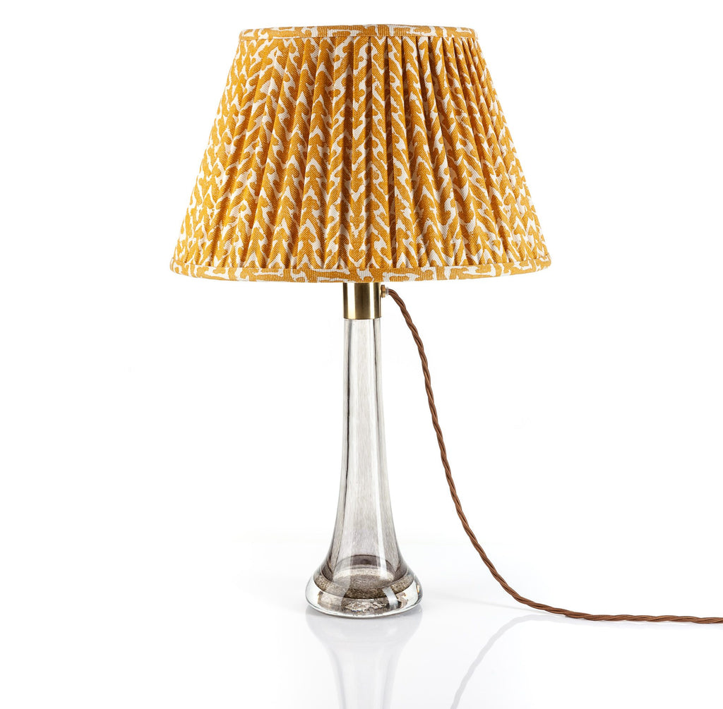 Fermoie Yellow Rabanna empire lampshade styled on a glass table lamp in Nashville, Tennessee
