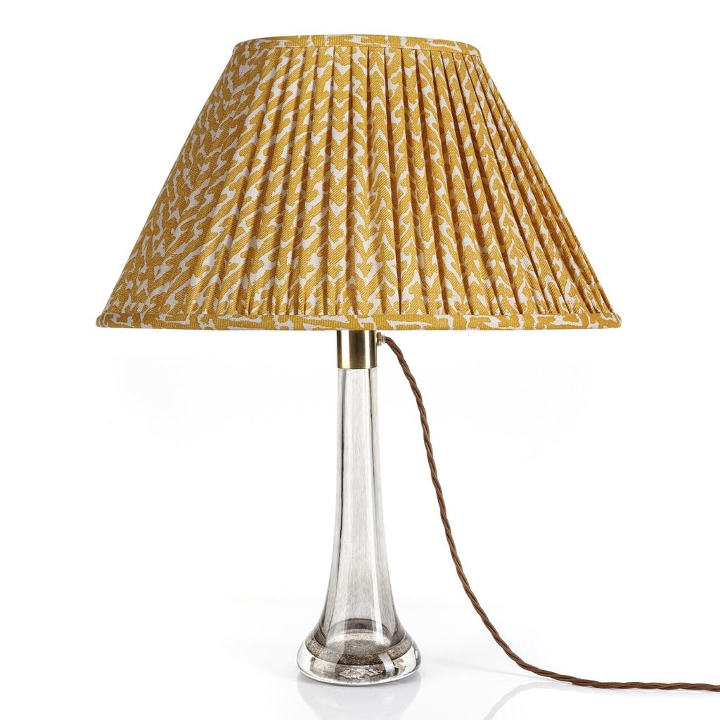 Fermoie Yellow Rabanna empire lampshade styled on a glass table lamp in Nashville, Tennessee