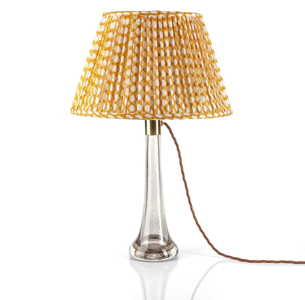 Fermoie Yellow Wicker Empire lampshade styled on a glass table lamp in Nashville, Tennessee