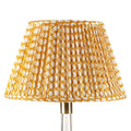 Fermoie Yellow Wicker empire lampshade styled on a glass table lamp in Nashville, Tennessee