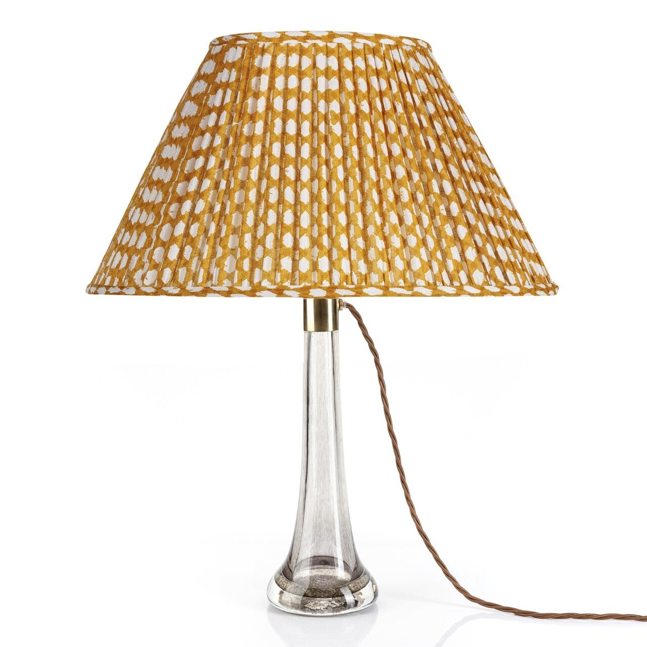 Fermoie Yellow Wicker oval lampshade styled on a glass table lamp in Nashville, Tennessee