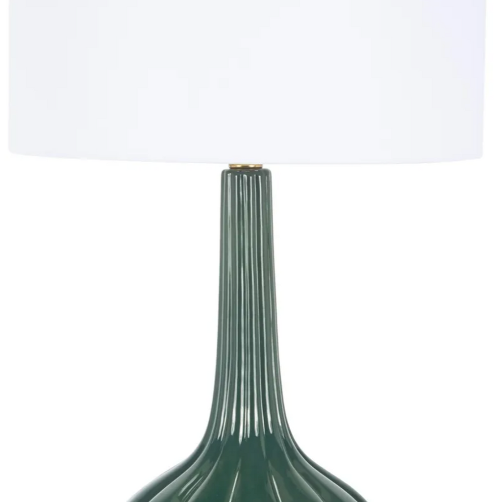 Forest green Laurel Table Lamp with glossy ribbed ceramic base, elongated fluted neck, brass accents, and white drum shade.