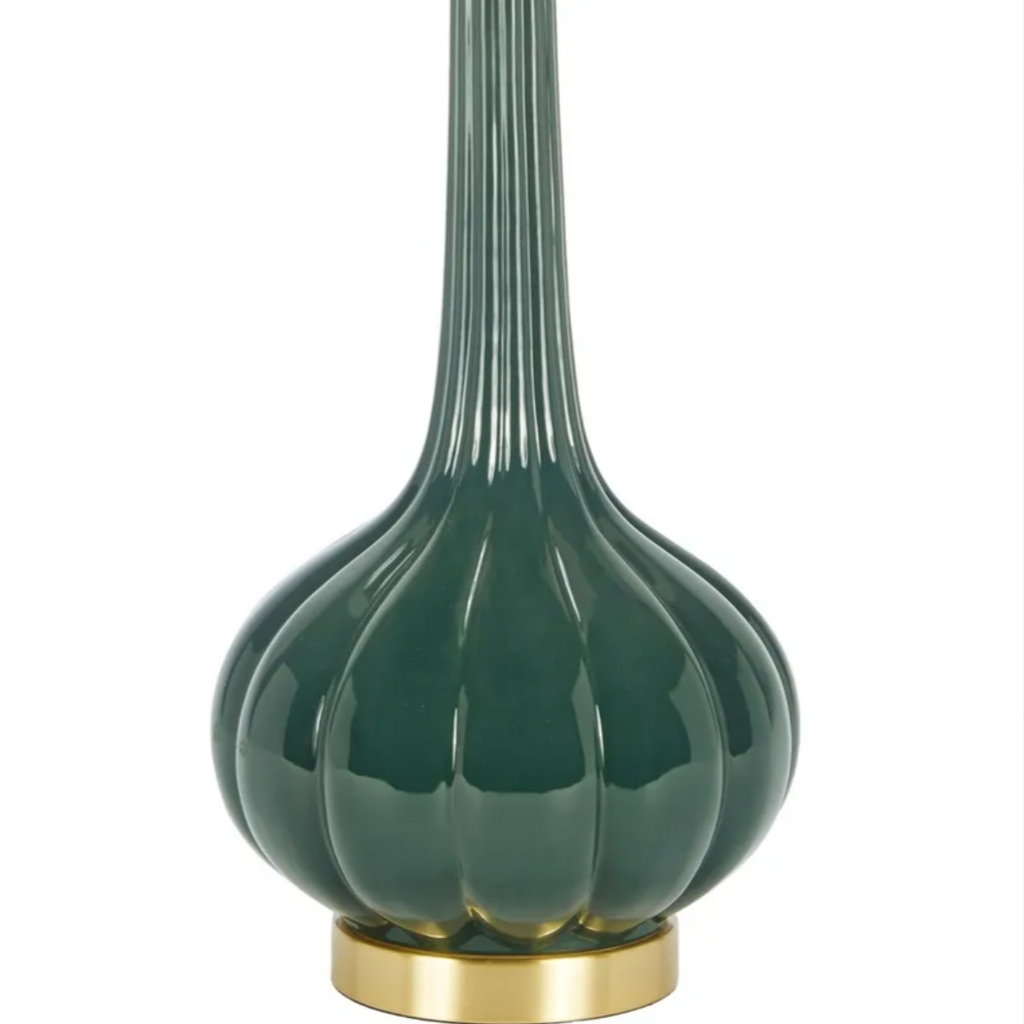 Forest green Laurel Table Lamp with glossy ribbed ceramic base, elongated fluted neck, brass accents, and white drum shade.
