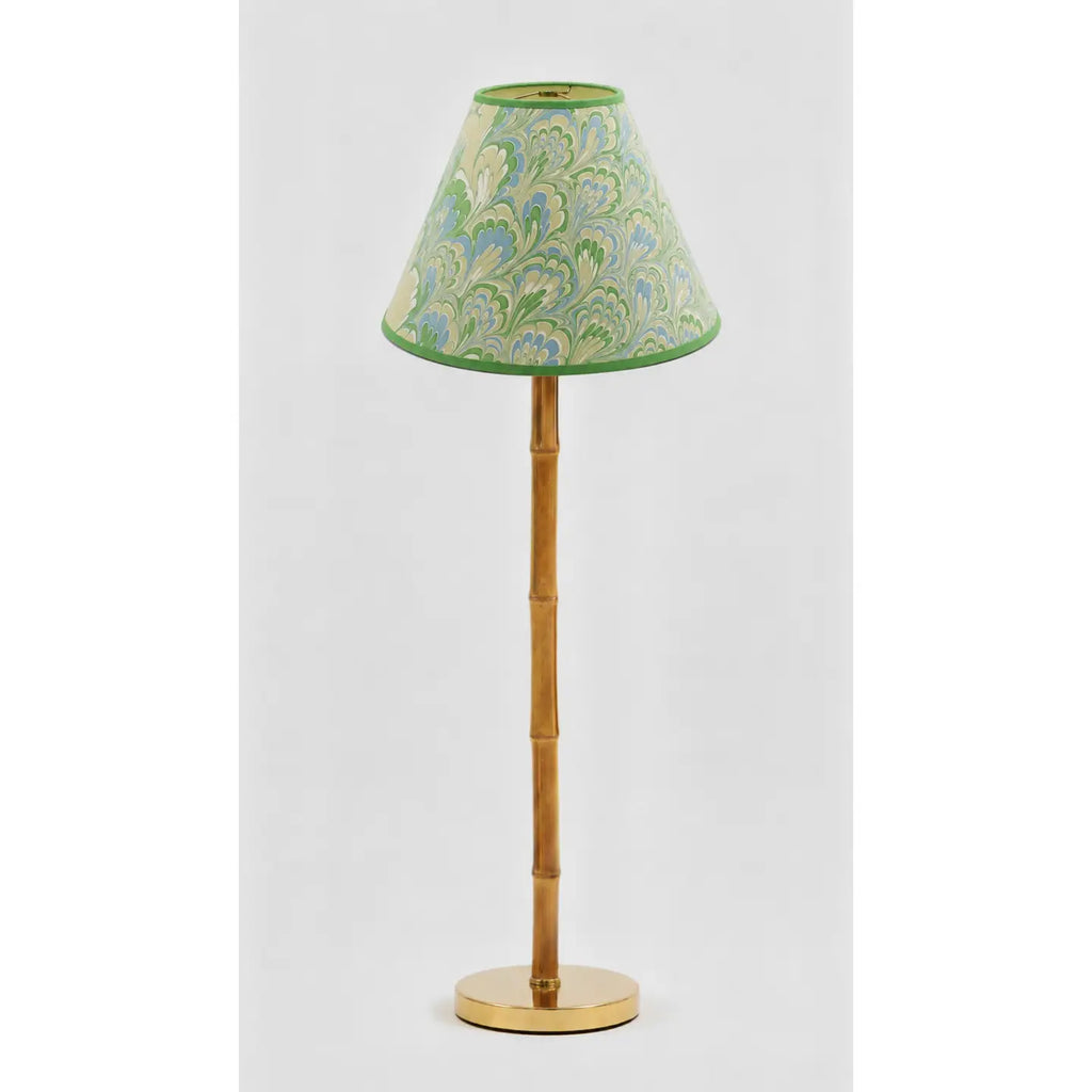 Green and blue marbled empire lampshade styled on a wood buffet lamp