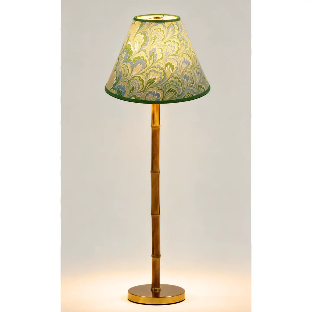 Green and blue marbled empire lampshade styled on a wood buffet lamp