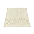 Eggshell silk lampshade with vertical pleating and intricate bottom smocked detailing in a tapered empire silhouette.
