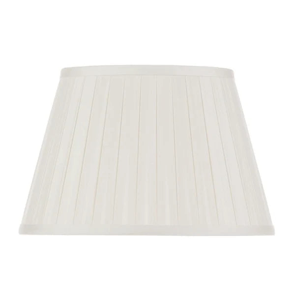Eggshell silk box pleat lampshade with fine vertical pleating, matching fabric trim, and a classic tapered empire silhouette.