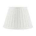 Off White linen lampshade with tailored box pleats, matching fabric trim, and a classic tapered empire silhouette.