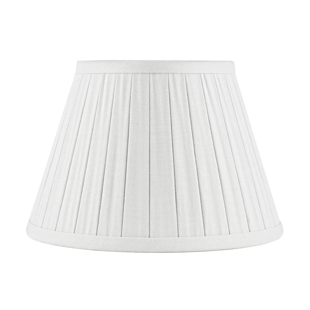 Off White linen lampshade with tailored box pleats, matching fabric trim, and a classic tapered empire silhouette.