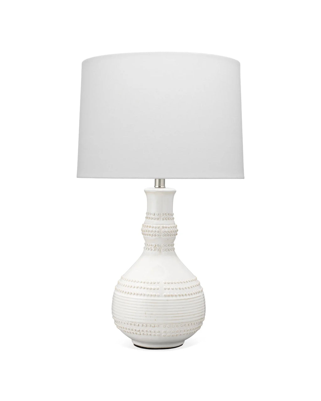 Organic ceramic white table lamp with raised knob texture and sculptural profile.
