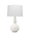 Organic ceramic white table lamp with raised knob texture and sculptural profile.