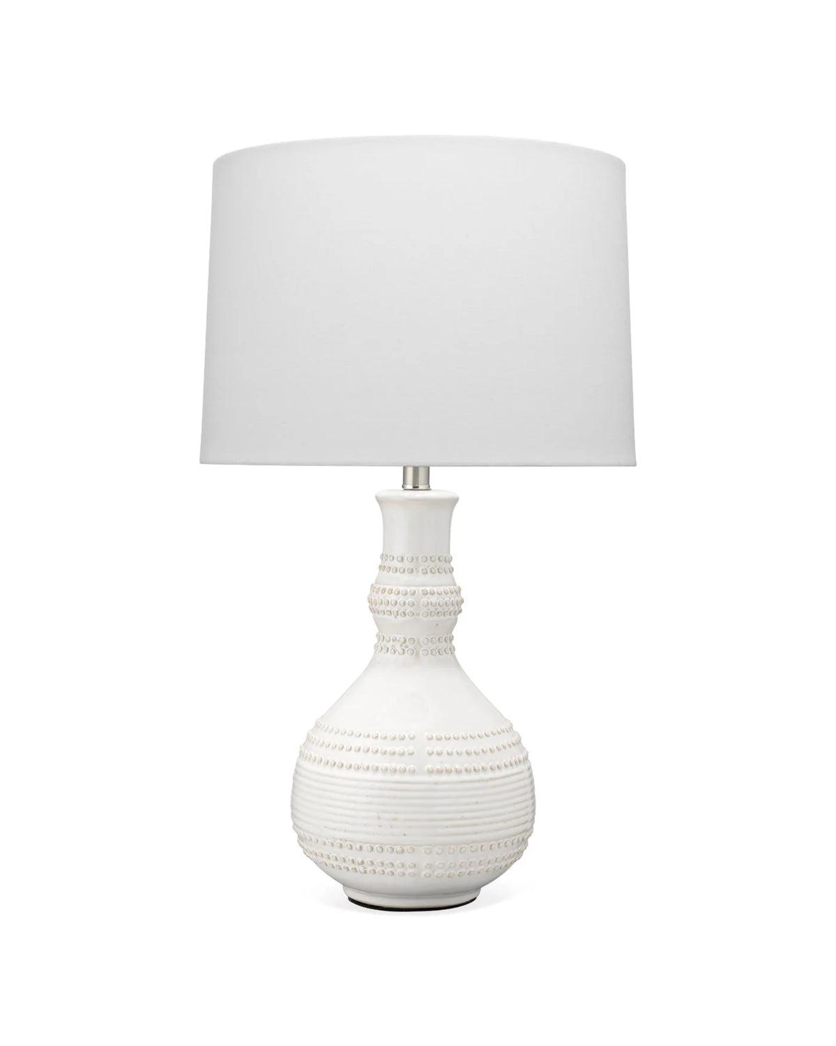 Organic ceramic white table lamp with raised knob texture and sculptural profile.