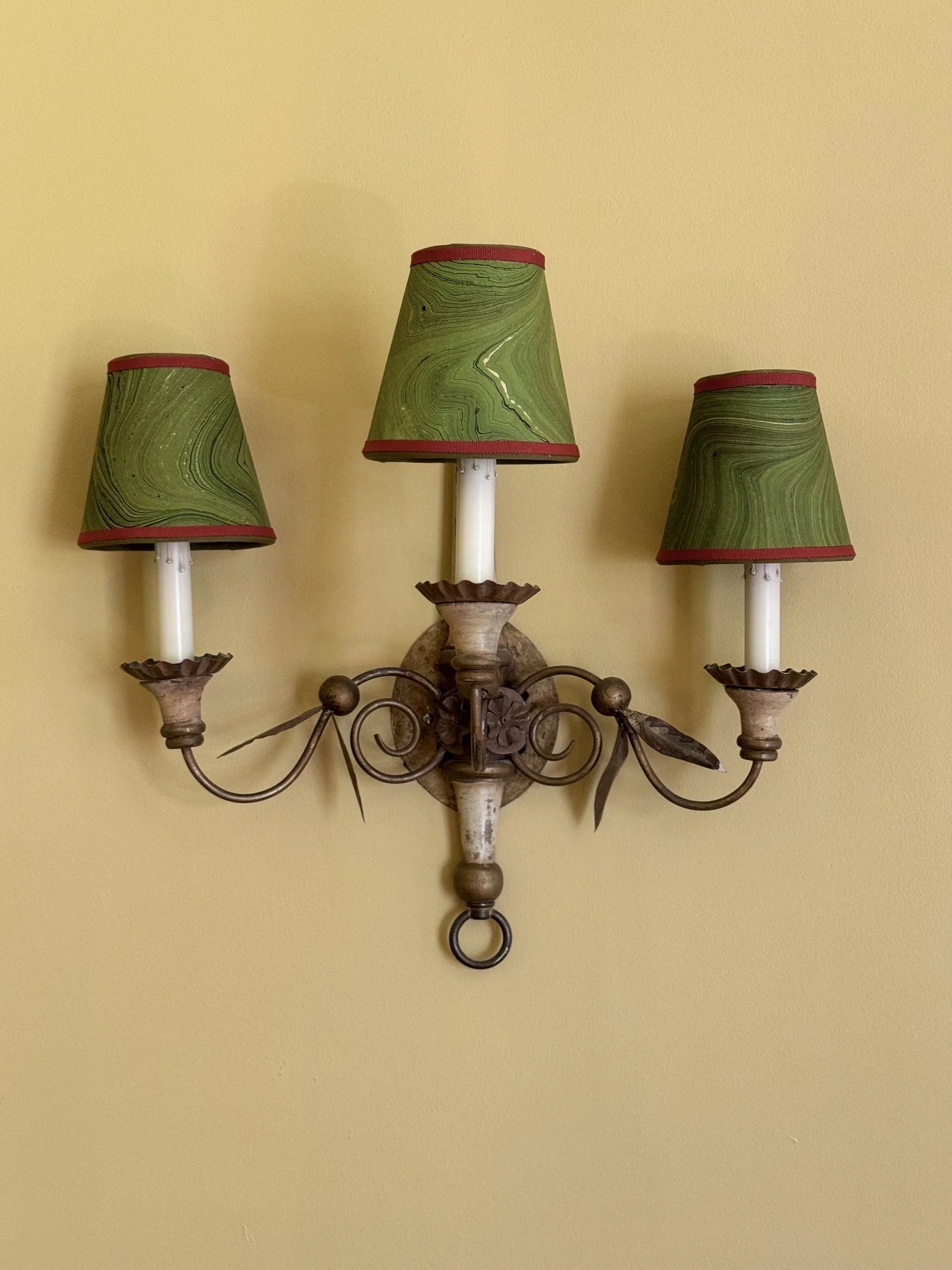 Marbled Green Sconce Lampshade with Red Trim styled on an antique bronze sconce in Nashville, Tennessee