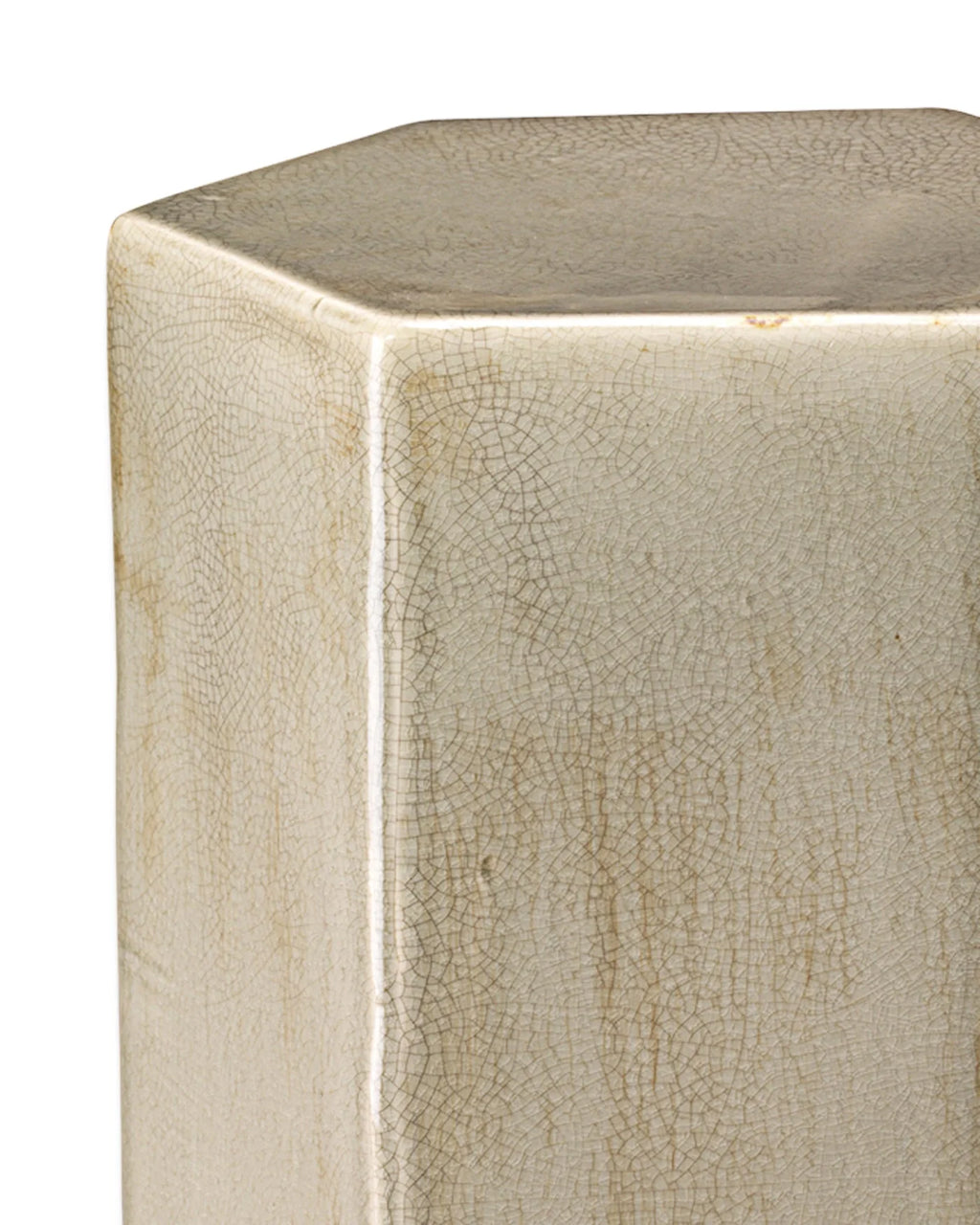 Close-up of a hexagonal ceramic stool or pedestal with a glossy beige glaze and fine crackle pattern on a white background.