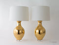 Paul Schneider Athens Lustre in Gold Lamp styled with white drum shades