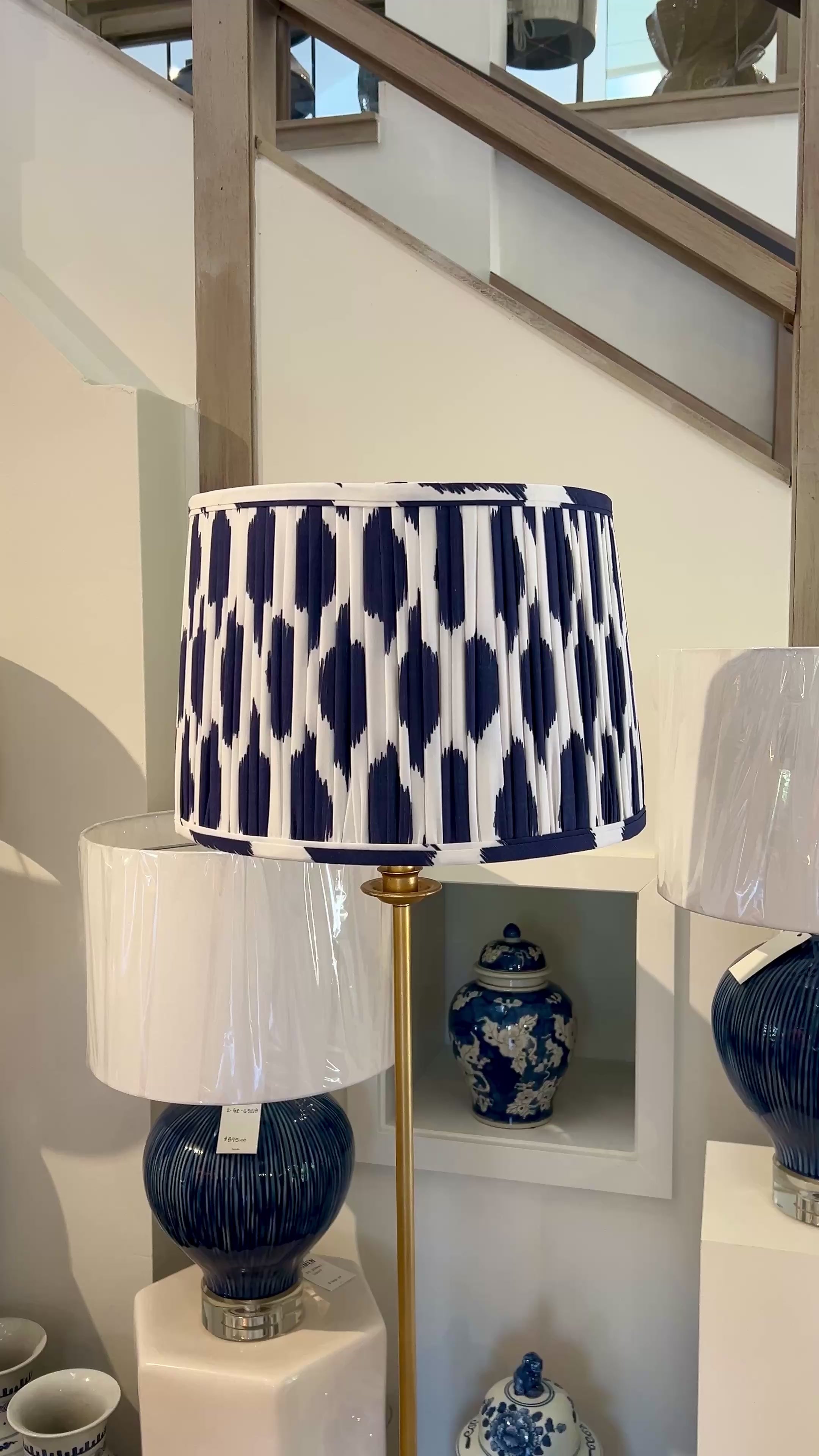 Sorella Glenn Navy Ikat Drum Lampshade styled on a brass floor lamp in Nashville, Tennessee