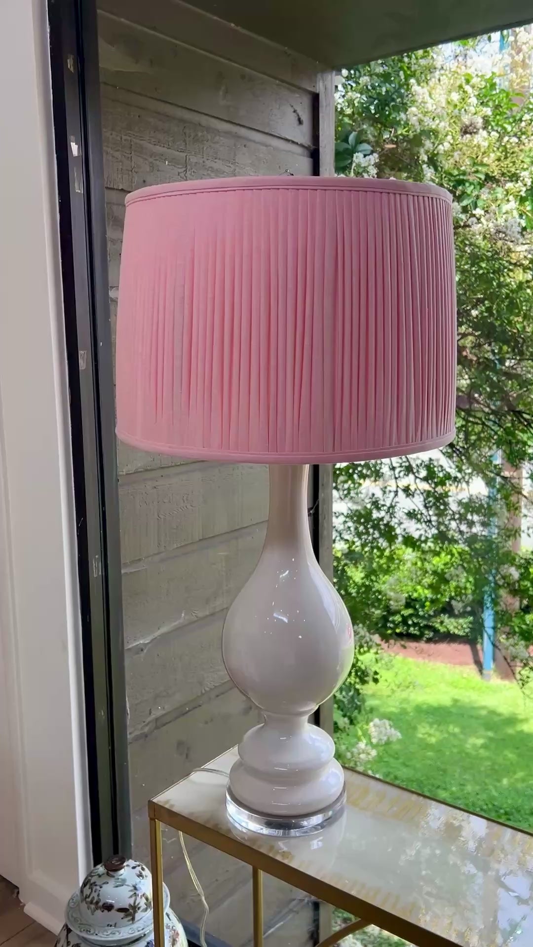 Sorella Glen Light Pink Shirred Drum Lampshade styled on a large white ceramic table lamp in Nashville, Tennessee