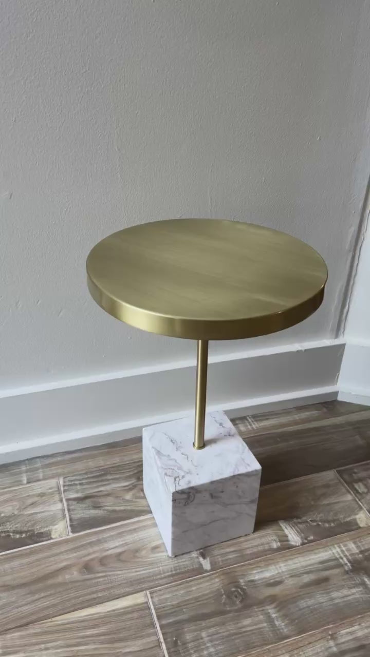 Contemporary white marble and brass top side table.