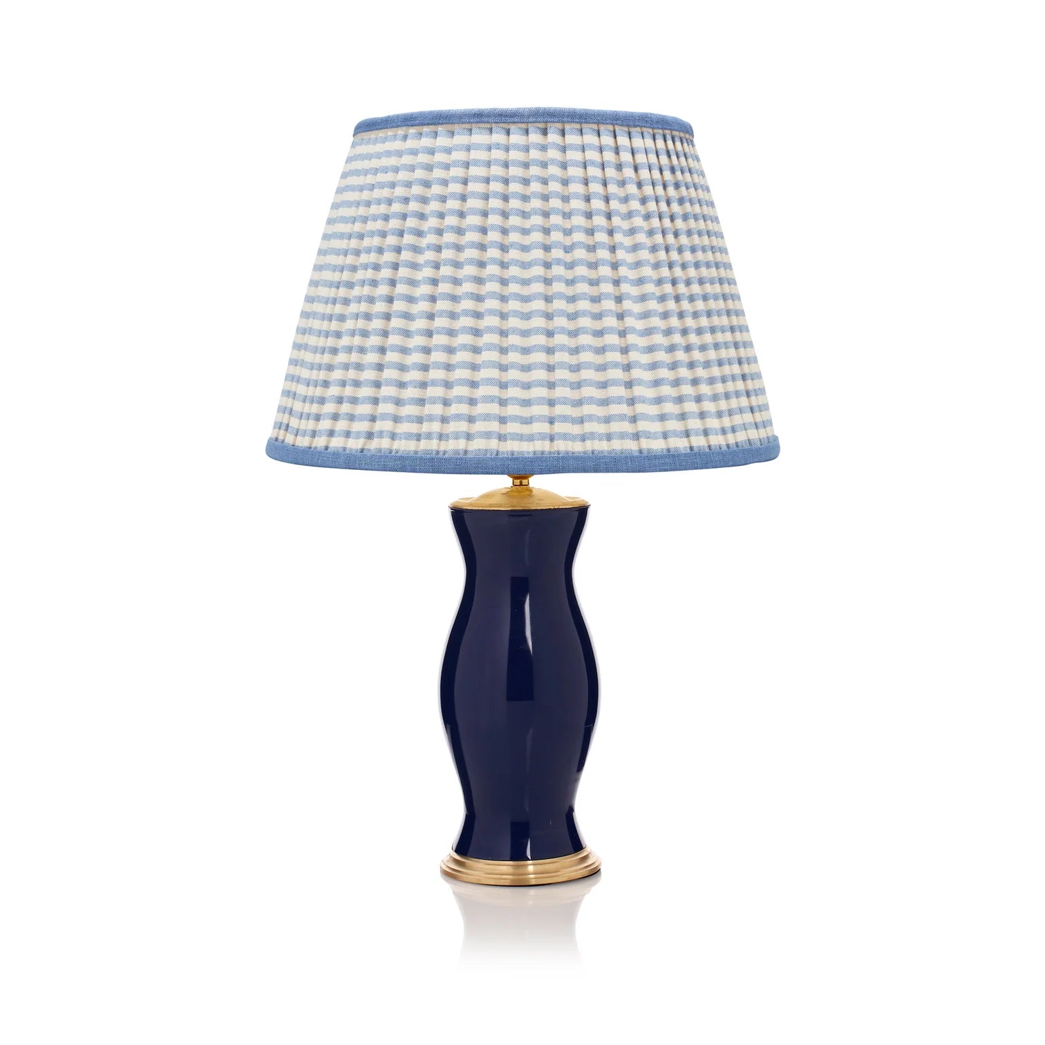 Rosanna Lonsdale Blue Striped Empire Lampshade styled on a navy blue table lamp in Nashville, Tennessee