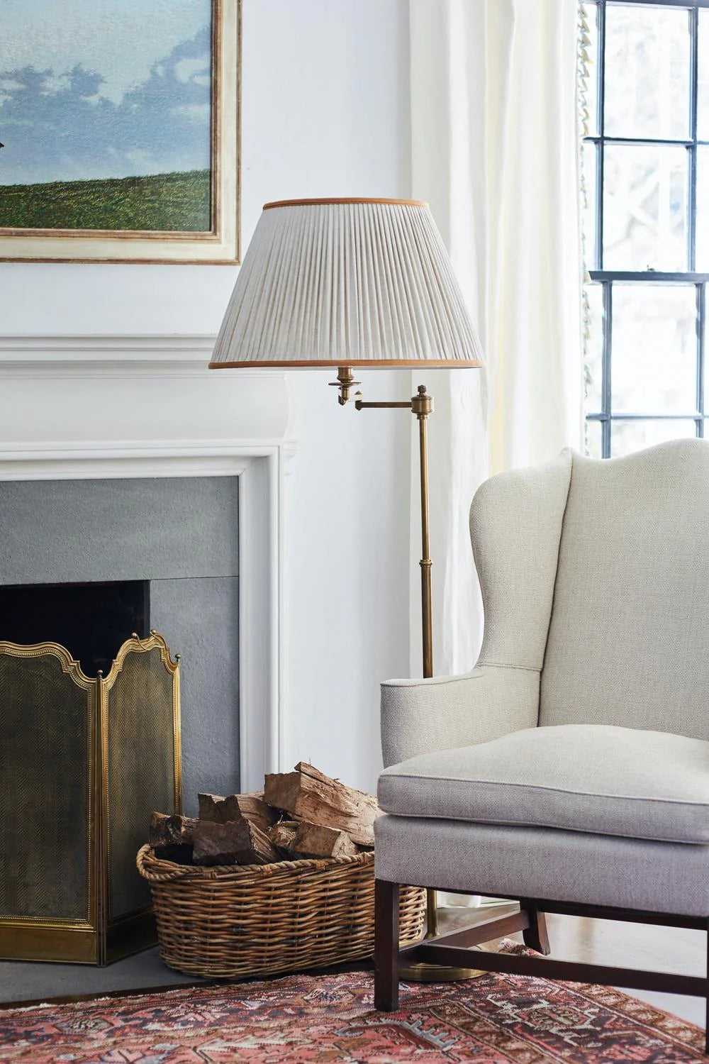 Sorella Glen Oatmeal Shirred Empire Lampshade with Caramel Trim styled on a brass floor lamp in Nashville, Tennessee