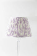 Sorella Glenn Soft Lavender Ikat empire lampshade styled on an acrylic table lamp