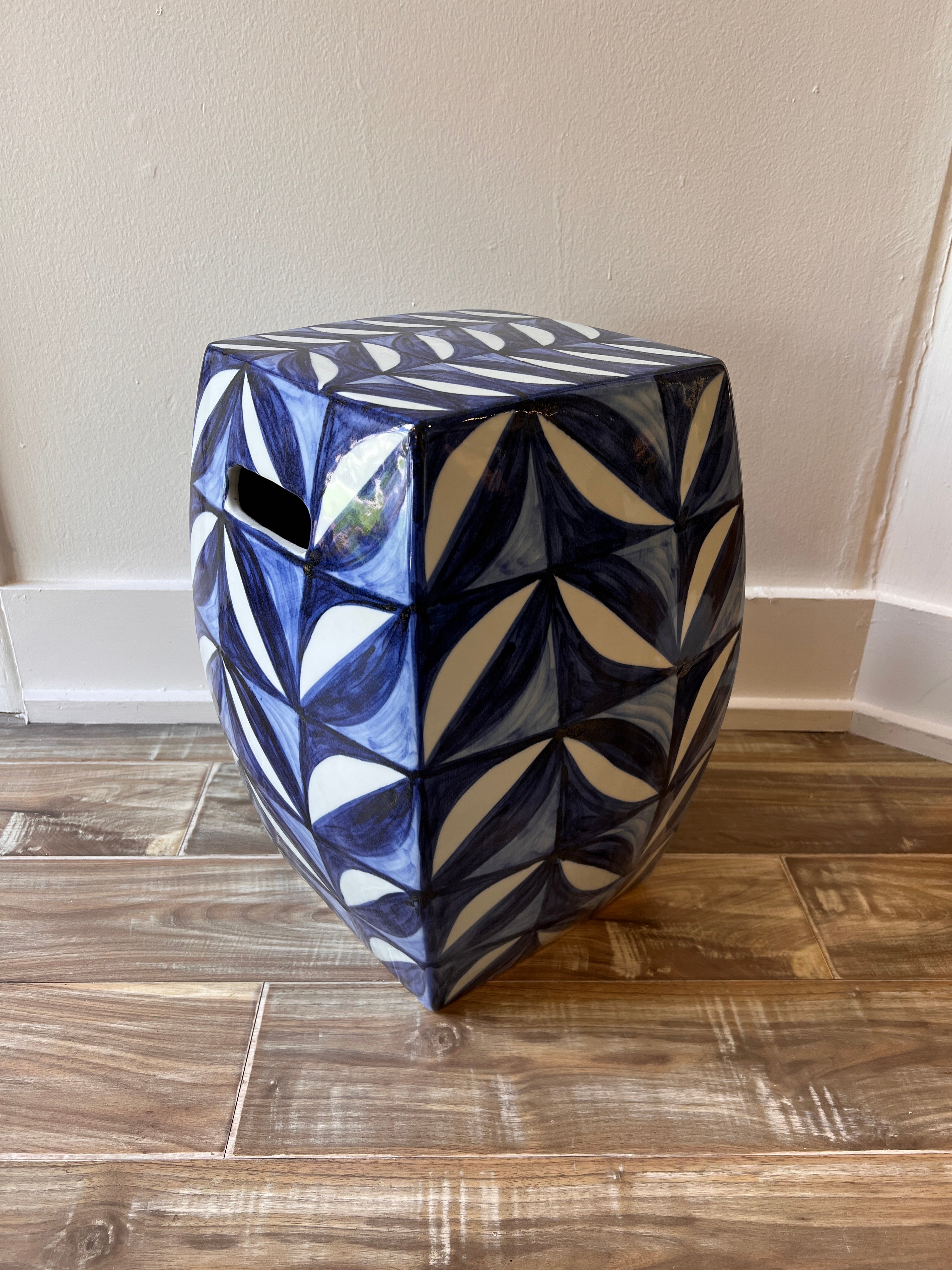 Ceramic garden stool with blue leaf motif styled in Nashville, TN