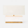 White rectangular table lamp with a contemporary, geometric design and brass base. Paired with a rectangular lampshade and available in Nashville, Tennessee