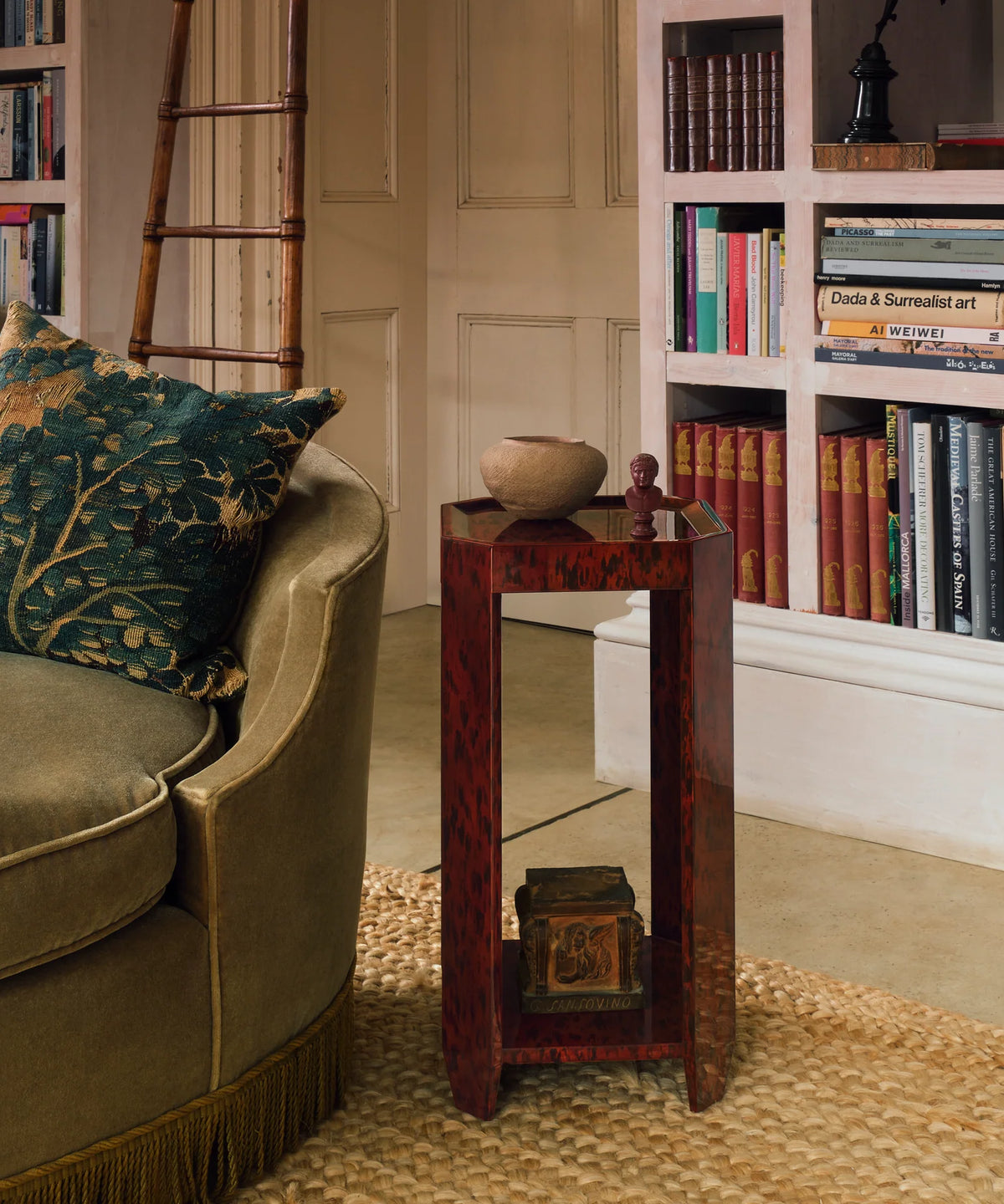 Felix Drinks Table in Brown Tortoiseshell with a glossy red-brown lacquer finish, raised-edge square top, open geometric frame, and lower shelf.