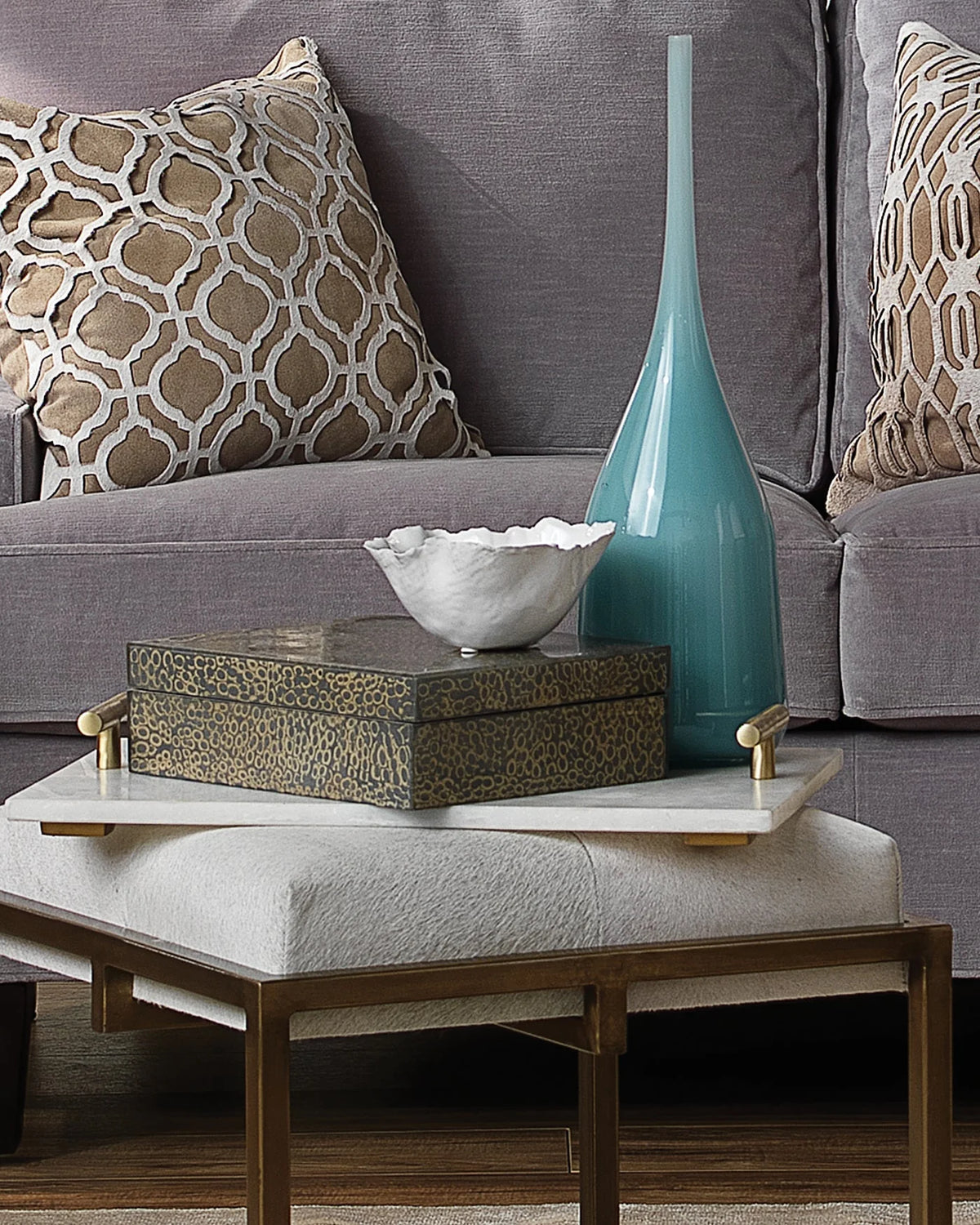 White decorative bowl styled on a coffee table. 