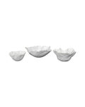 Set of three white decorative bowls inspired by a soft petal shape.