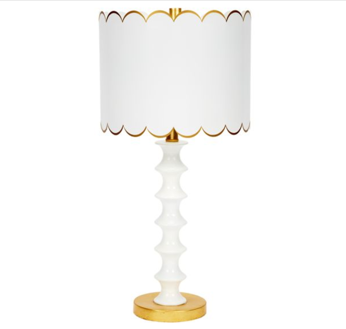 White table lamp with gold base and white scalloped lampshade
