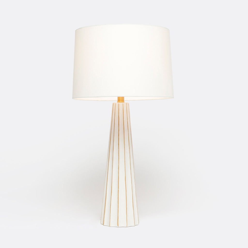 Aurelia white concrete table lamp with scallop detail and gold leaf accents. Styled with a white linen drum, available in Nashville, Tennessee