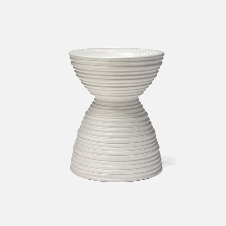 White sculptural garden stool with hourglass silhouette